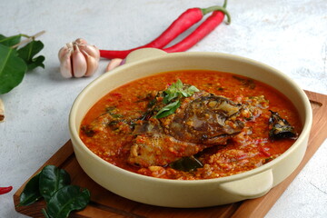 Ikan Woku. Minahasan styled dish of fish braised with lightly-crushed red chili pepper.