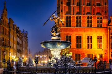 Neptune's Fountain in Gdansk at wintery night. Poland