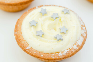 All-butter pastry pies with a mincemeat filling with spiced vine fruits, topped with brandy buttercream and a sweet dusting