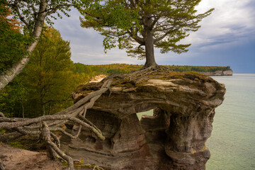 Fototapeta na wymiar Autumn colors at Chapel Rock, on the Chapel Basin Loop, at Lake Superior, Pictured Rocks National Lakeshore, Michigan.