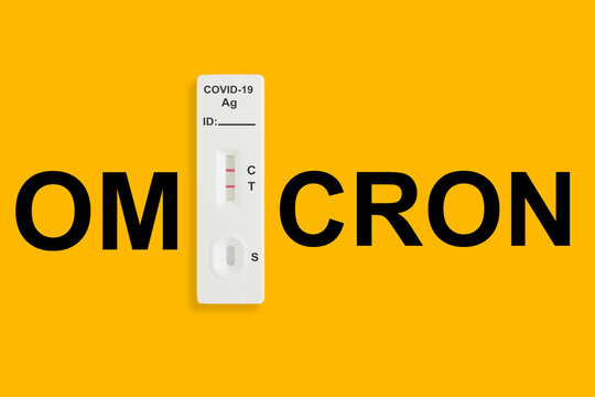 Rapid antigen test kit with positive result during swab COVID 19 testing. Covid 19 omicron variant outbreak around the world