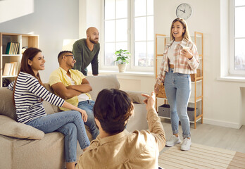 Happy mixed race multi ethnic friends having fun together. Small group of cheerful young diverse...