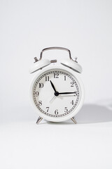 Vertical photo of white vintage watch on white isolated background