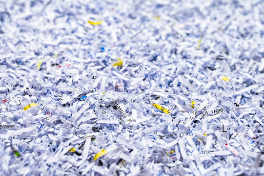 A pile of shredded papers, documents and files. Data protection, destruction or erasure background.