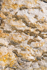Natural natural stone with yellow, white and gray color. Volume texture
