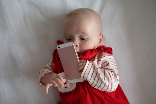 Baby Playing Woth Phone Holding It For First Time In Her Life.