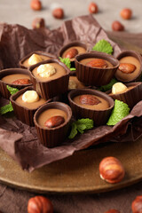 Concept of sweets with chocolate candies on textured background