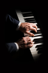 Pianist plays chord on piano with both hands. Touches gently the keyboard. White, male, mature...