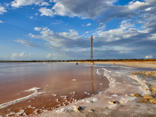 Sunset on the pink lagoon of the salt flats of Torrevieja, Spain