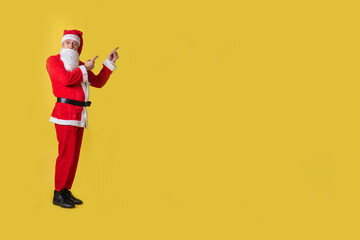 Fototapeta na wymiar Santa claus yellow food big, eat holiday christmas costume people. Trendy celebrate. Ruks at the top shows