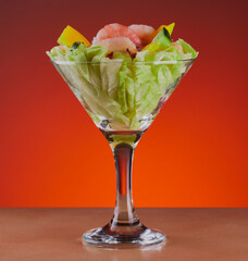 Prawn cocktail in a cocktail glass ,isolated on a gradient background.
