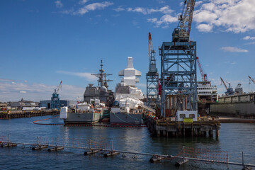 Seattle, Washington, USA - June 4 2021: Seattle dock and Navy ships during summer. View from Elliott Bay. Space Needle. Washington state.