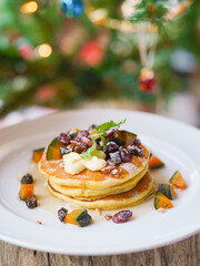 Pancake. Pancake with maple syrup topping with pimpkins and dried berries for breakfast.