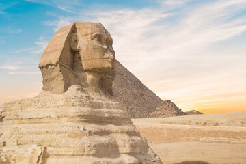 Great Sphinx against the background of the pyramids of the pharaohs Cheops, Khafren, and Mikerin in...