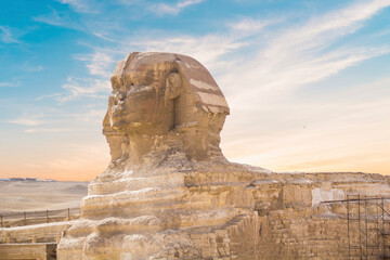Obraz na płótnie Canvas Great Sphinx against the background of the pyramids of the pharaohs Cheops, Khafren, and Mikerin in Giza, Egypt