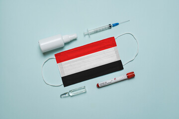 Blood tube for test detection of virus Covid-19 Omicron Variant with positive result, medicine mask with Yemen flag superimposed and vaccine.  New Variant of the Covid-19 Omicron - 475728030