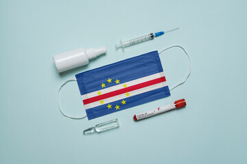 Blood tube for test detection of virus Covid-19 Omicron Variant with positive result, medicine mask with Cape Verde flag superimposed and vaccine.  New Variant of the Covid-19 Omicron - 475728046
