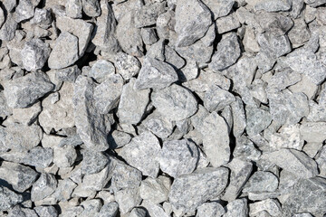 Grey stone rubble, background of many small stones