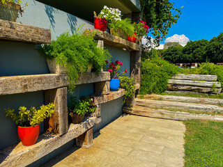 Fototapeta na wymiar Landscaping on a garden wall, Pots and flowers