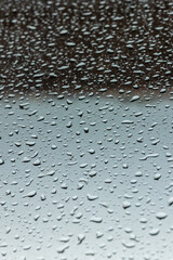 raindrops on the glass. abstraction and a beautiful background, free space for text or a place for an advertising inscription. photo of the window after the rain. weather forecast and rains with snow