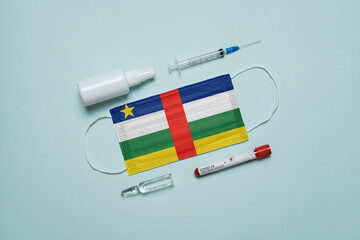 Blood tube for test detection of virus Covid-19 Omicron Variant with positive result, medicine mask with Central African Republic flag superimposed and vaccine.  New Variant of the Covid-19 Omicron - 475731841
