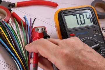 Measurement of battery voltage using a multimeter.