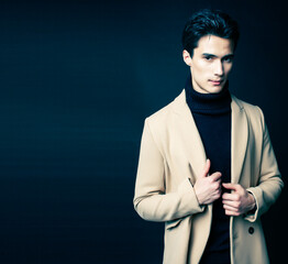 handsome asian fashion looking man posing in studio on black background, lifestyle modern people concept