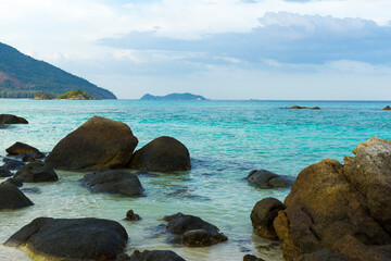 Sea wave flowing to rock on beach of Lipe island in Thailand.