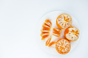 bright and juicy tangerines on a white background. Selective focus.
 fresh fruit, the smell of the...