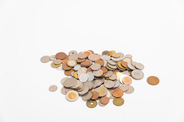 Many kind of coin country pile up on white background.