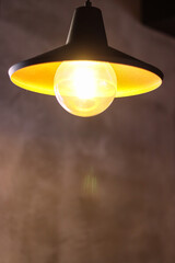 hanging lamp. lamp on the wall. chandelier in the room. lamp close-up. lamp with yellow light