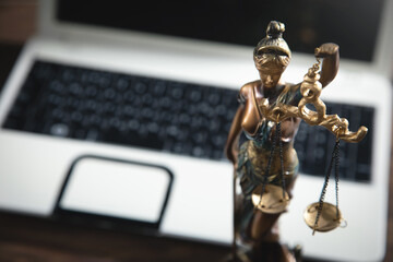 Lady Justice Statue with a computer.