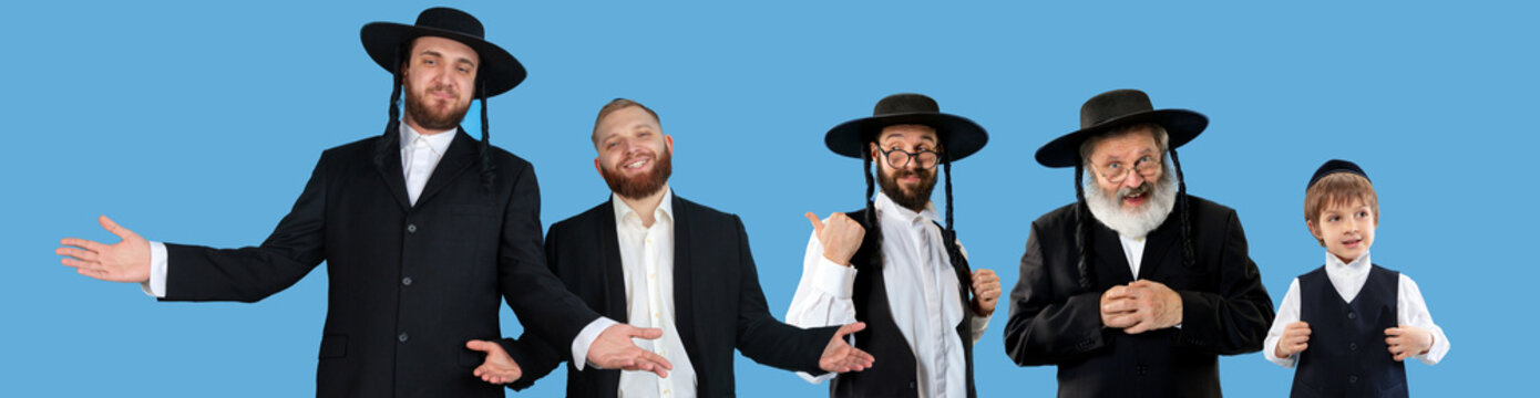 Set of portraits of mixed aged emotional men, orthodox jewish men standing together on blue background.