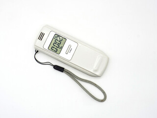 Modern breathalyzer and mouthpieces on white background