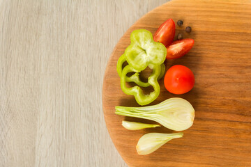 Healthy eating. eco-friendly products. vegetables fresh tomato with onion, garlic and spices on cutting board. Copy space