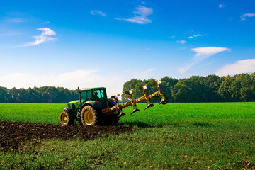 Tractor farm. Agriculture farm machinery on landscape land field. Farmer machine equipment for...