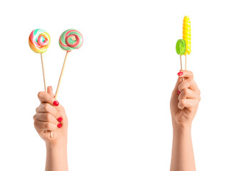 Woman holding different sweet lollipops on white background