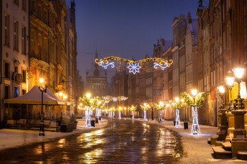 Beautiful Christmas decorations in the old town of Gdansk at wintery night. Poland