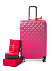 Suitcase and gift boxes. Christmas vacation concept