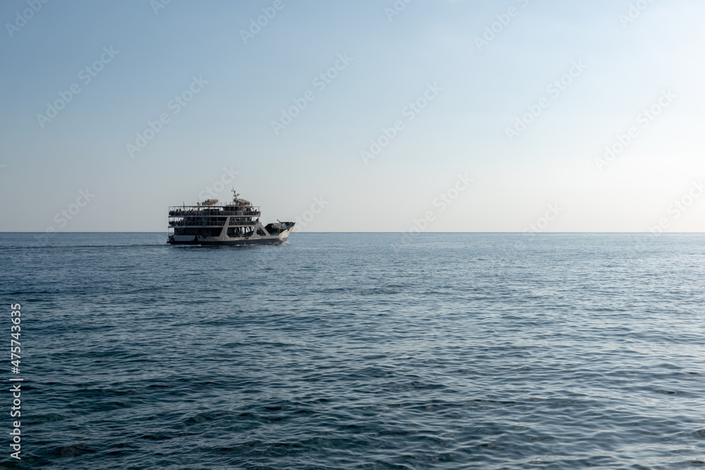 Sticker beautiful shot of a boat on a sea in crete