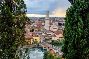 Naklejka premium Panoramic from the top of the Castle of Verona, with a view of the roofs and the alleys of the medieval city along the river.