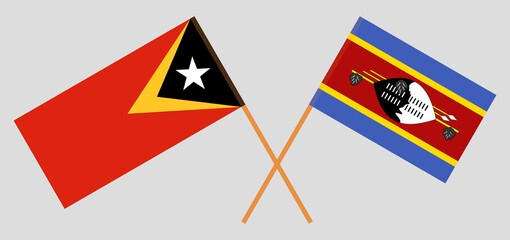 Crossed flags of East Timor and Eswatini. Official colors. Correct proportion