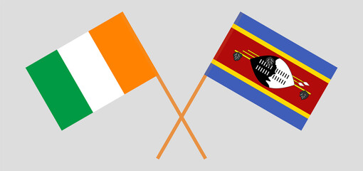 Crossed flags of Ivory Coast and Eswatini. Official colors. Correct proportion