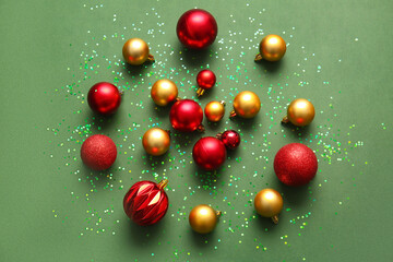 Stylish Christmas balls on green background