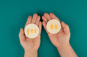 The words yes and no are standing on round signs, communication symbol, making a decision, business...