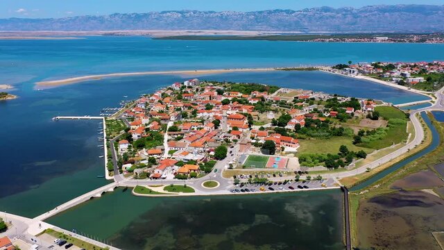 Historic town of Nin laguna aerial view with Velebit mountain background, Dalmatia region of Croatia. Aerial view of the famous Nin lagoon and medieval in Croatia