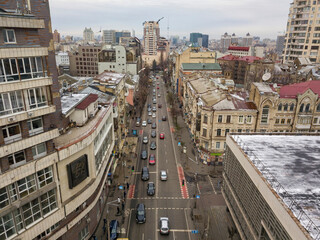 Fototapeta premium City street in Kiev in cloudy weather. Aerial drone view.