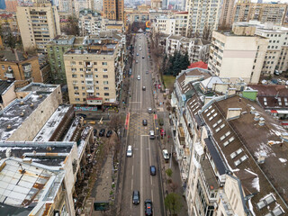 Fototapeta premium City street in Kiev in cloudy weather. Aerial drone view.
