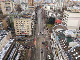 Fototapeta premium City street in Kiev in cloudy weather. Aerial drone view.