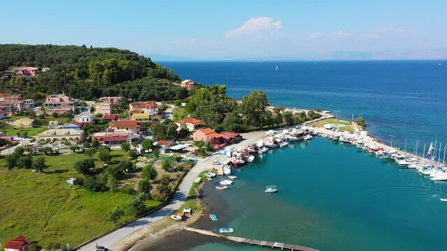 Beautiful Petriti fishing village with mountains in background, Ionian island, Corfu, Kyrkyra, Petriti.